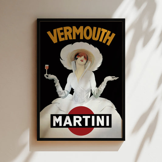 A framed poster featuring a woman in a white dress and hat, holding a glass of wine, with the text "VERMOUTH" and "MARTINI" prominently displayed.