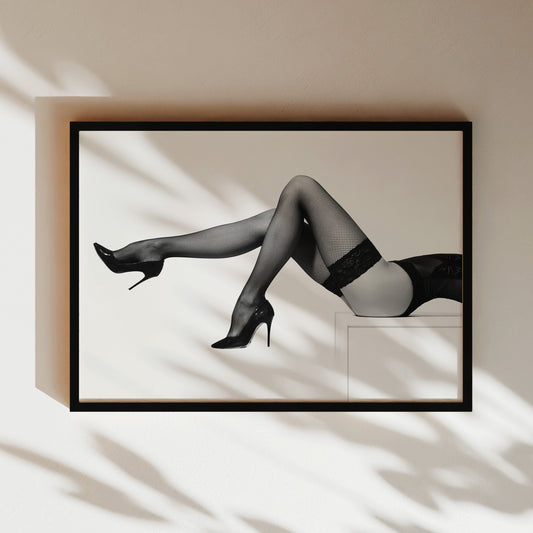 a black and white photo of a woman in stockings