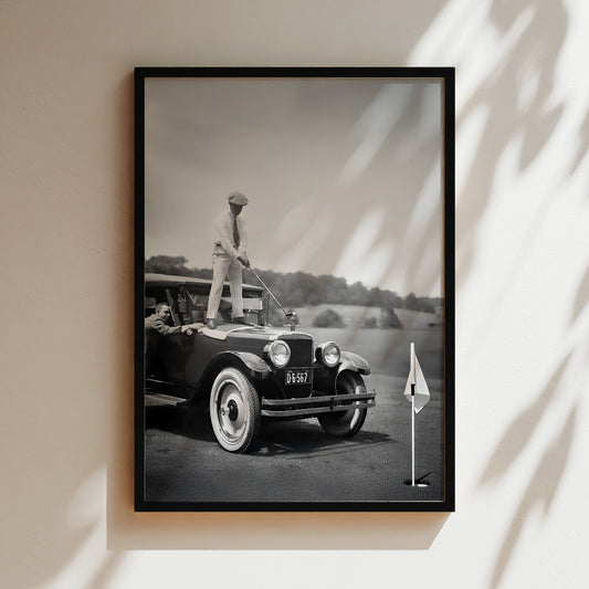 a black and white photo of a man standing on top of a car