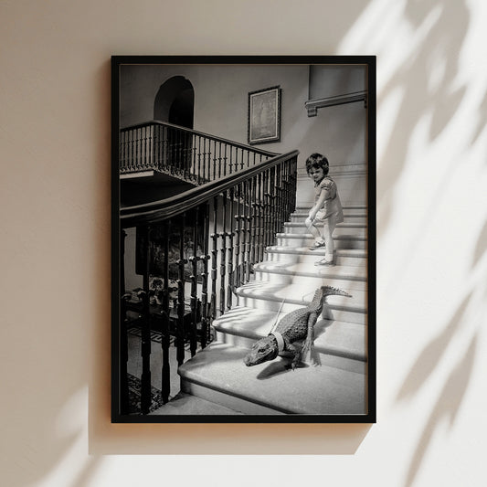 a black and white photo of a child and a dog