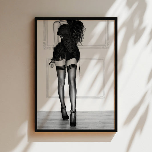 a black and white photo of a woman in high heels