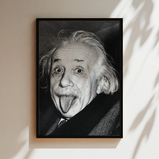 a black and white photo of a man sticking his tongue out