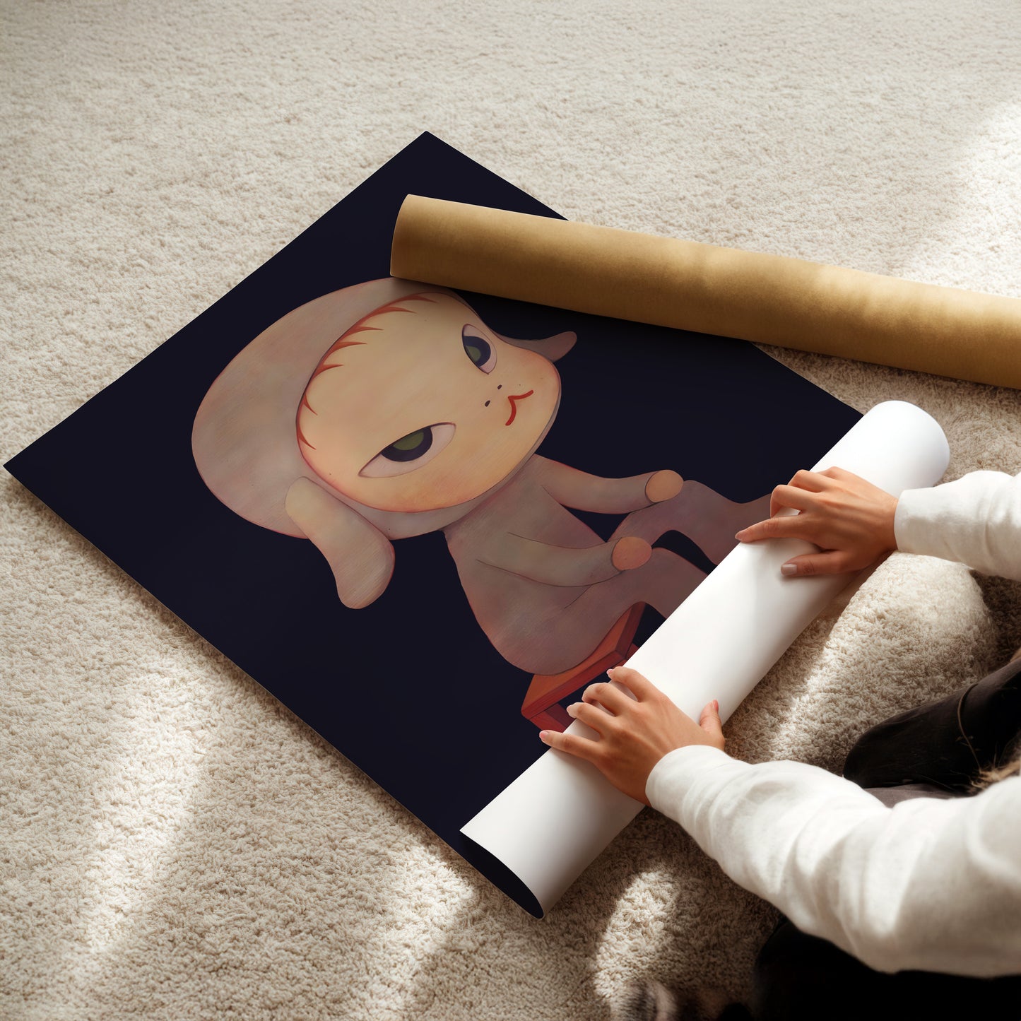 a child is playing with a picture of a cat