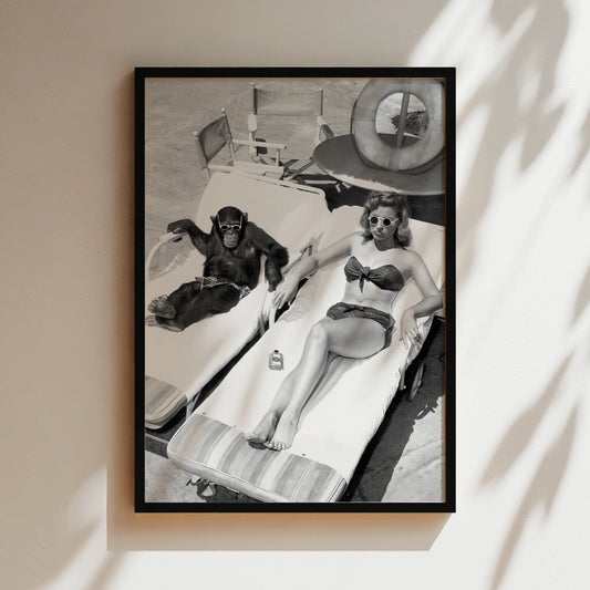 a black and white photo of two women in bathing suits