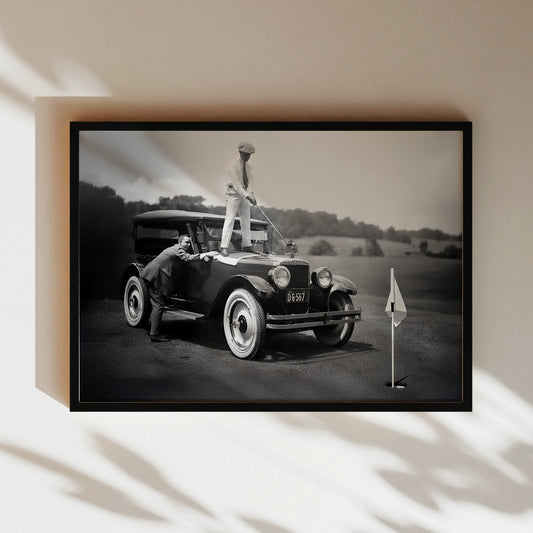 a black and white photo of a vintage car