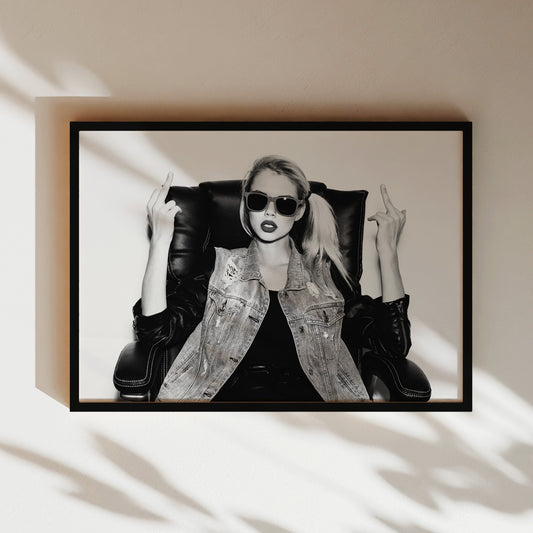 a black and white photo of a woman in a leather jacket