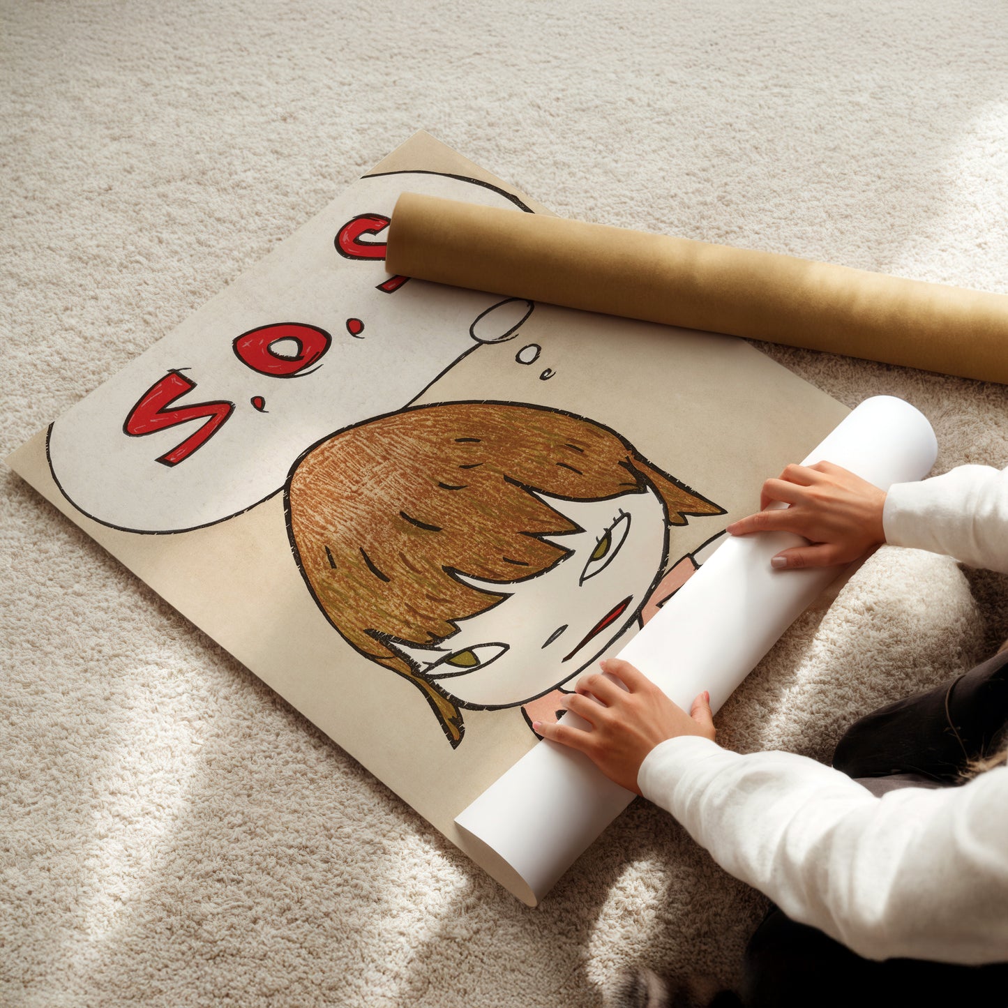 a little girl sitting on the floor reading a book