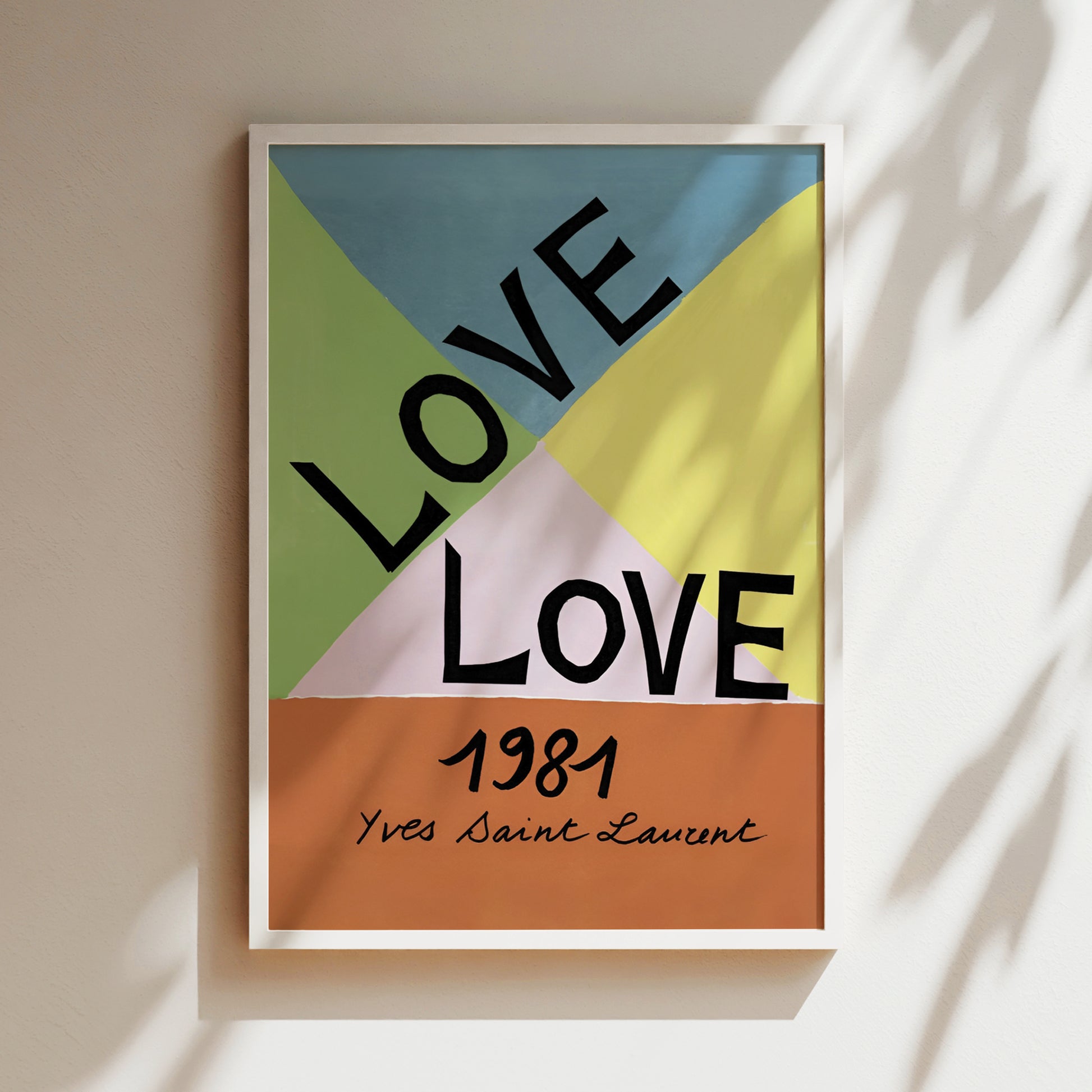 A framed poster with the text "LOVE" in large letters, surrounded by a colorful geometric design.