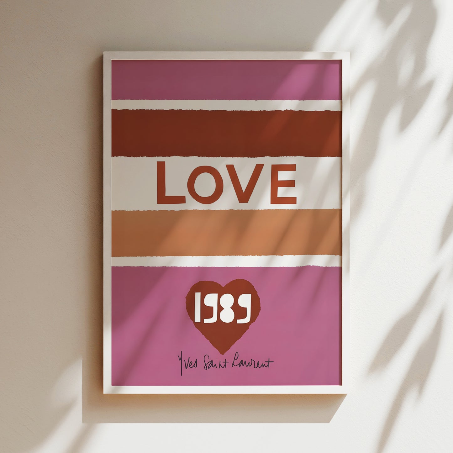 A framed poster with the word "LOVE" prominently displayed in the center, along with a heart symbol and the year "1988" below it.
