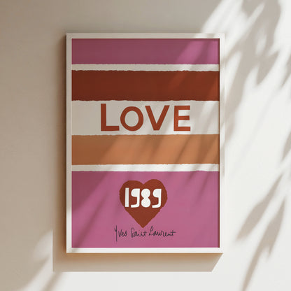 A framed poster with the word "LOVE" prominently displayed in the center, along with a heart symbol and the year "1988" below it.