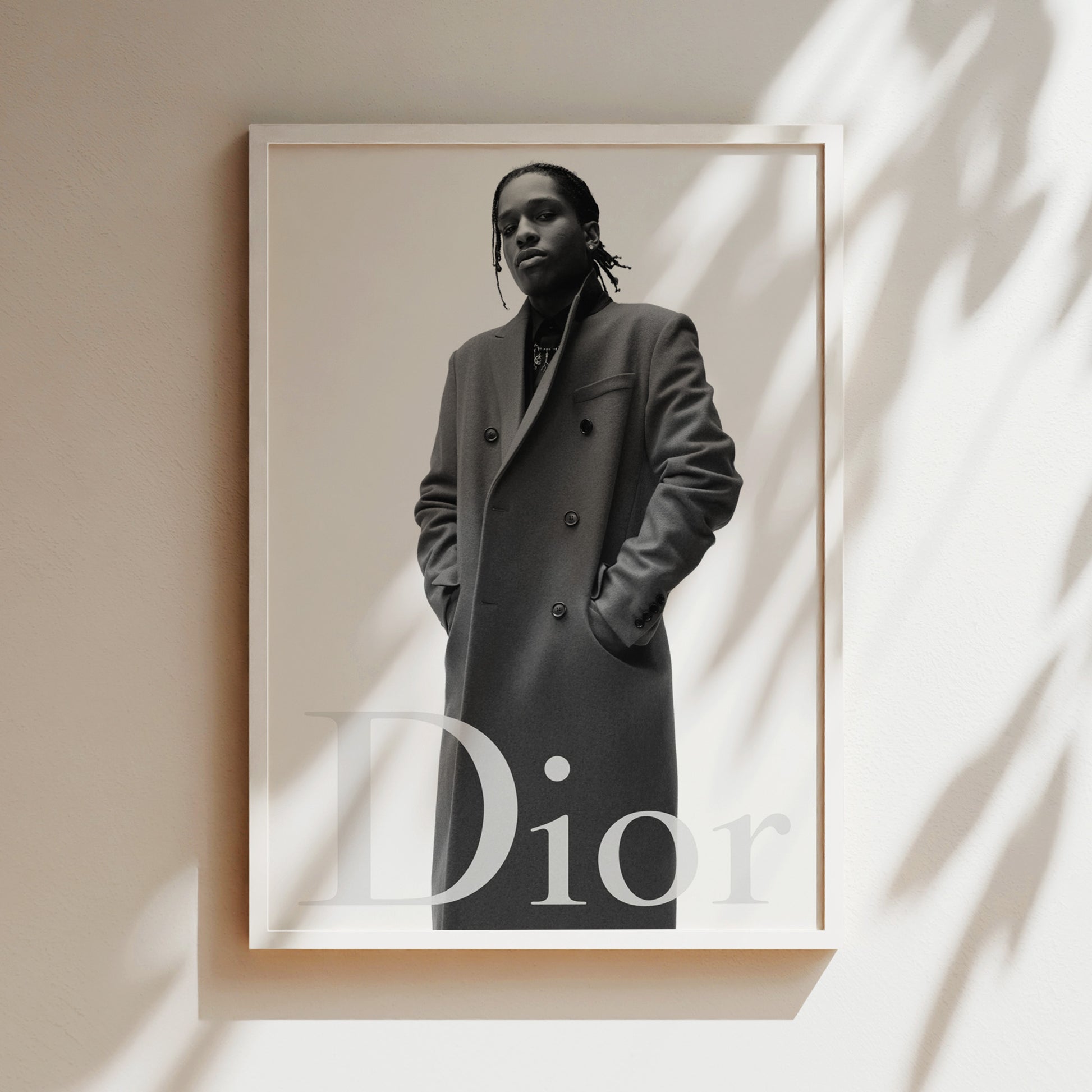 A black and white photograph of a person wearing a coat, with the word "Dior" prominently displayed in the bottom right corner.
