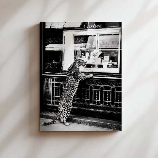 a black and white photo of a leopard standing in front of a store