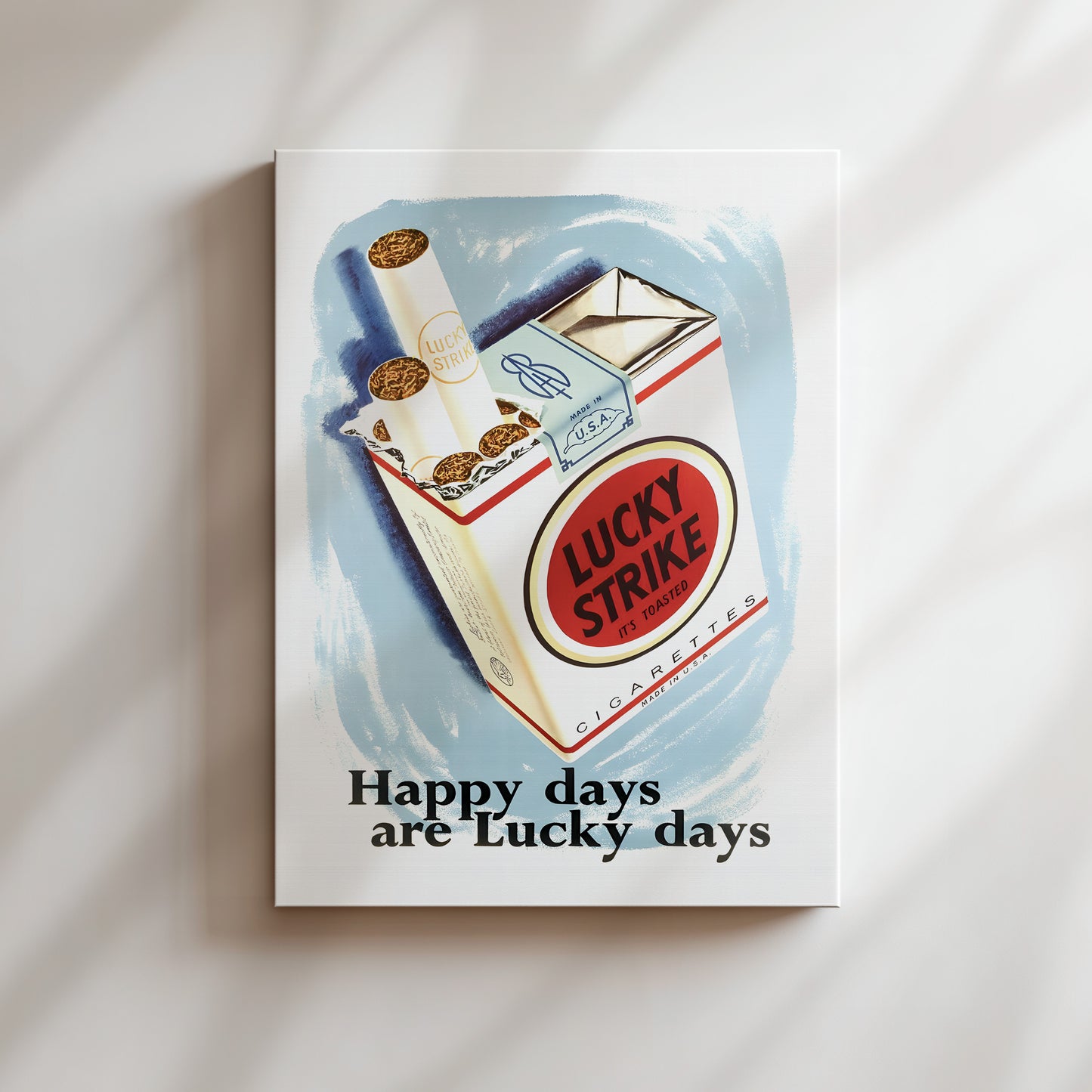 The image is a cigarette pack advertisement for Lucky Strike cigarettes, featuring a pack of Lucky Strike cigarettes and the text "Happy days are Lucky days".