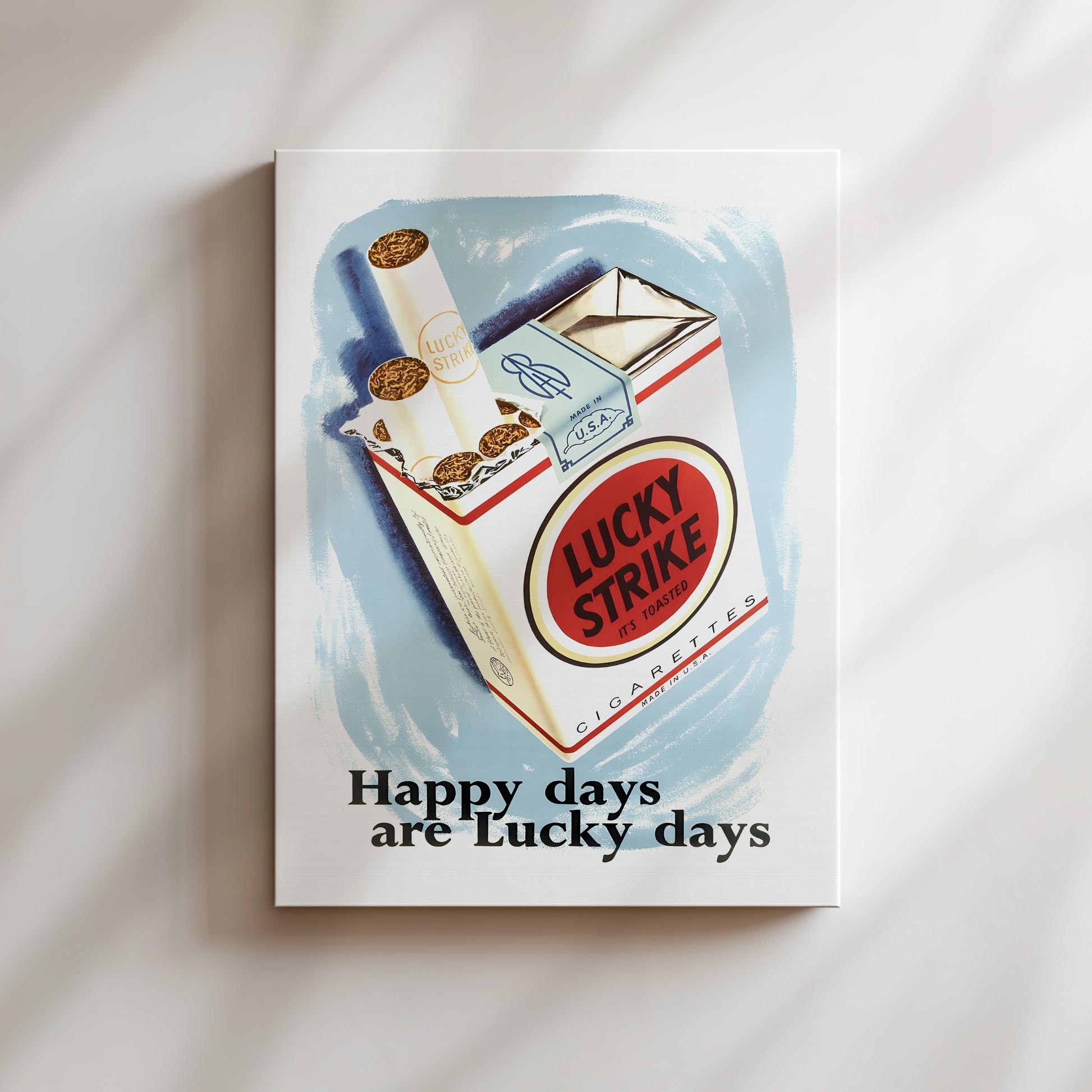 The image is a cigarette pack advertisement for Lucky Strike cigarettes, featuring a pack of Lucky Strike cigarettes and the text "Happy days are Lucky days".