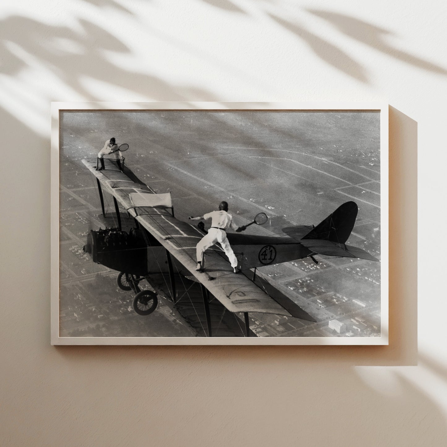 a black and white photo of a man on a plane