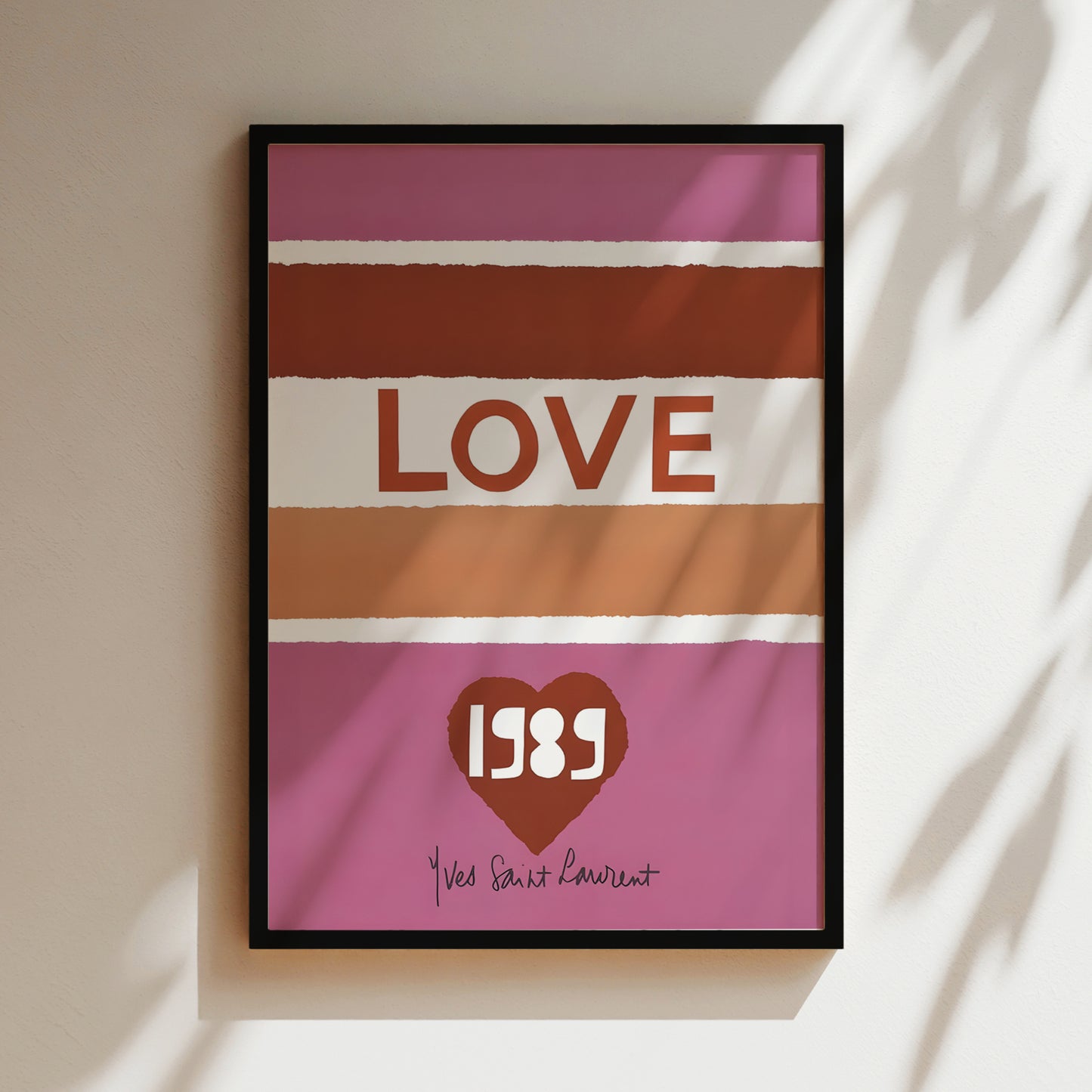 A framed poster with the word "LOVE" prominently displayed in the center, along with a heart symbol and the year "1989" below it.