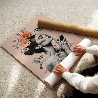 A person is holding a roll of paper and placing it under a framed artwork depicting a woman's face with flowers and birds.