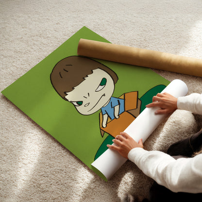 a child is holding a roll of paper with a picture of a boy on it