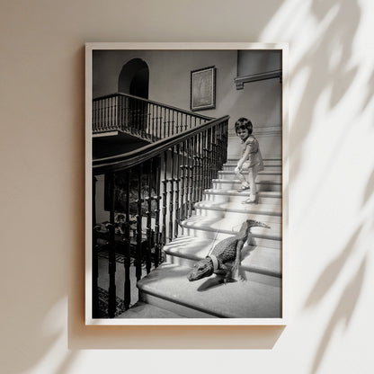 a black and white photo of a child and a dog