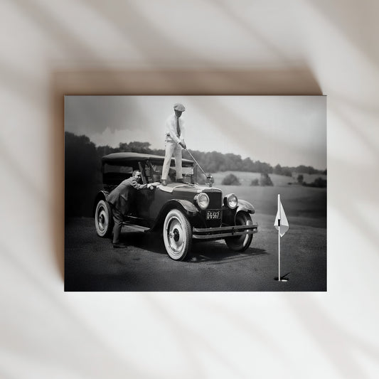 a black and white photo of a vintage car