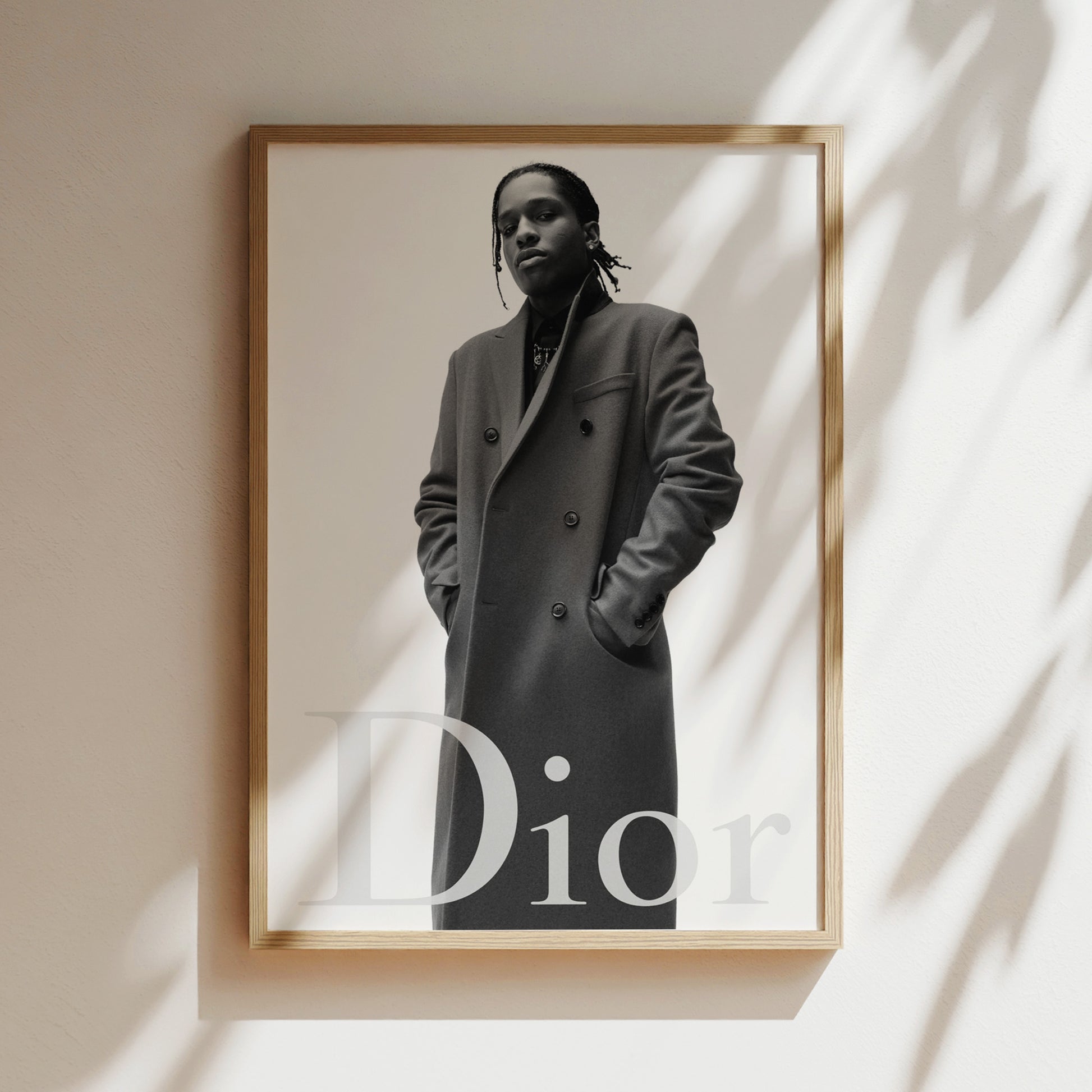 A black and white photograph of a person wearing a coat, with the word "Dior" displayed below the image.