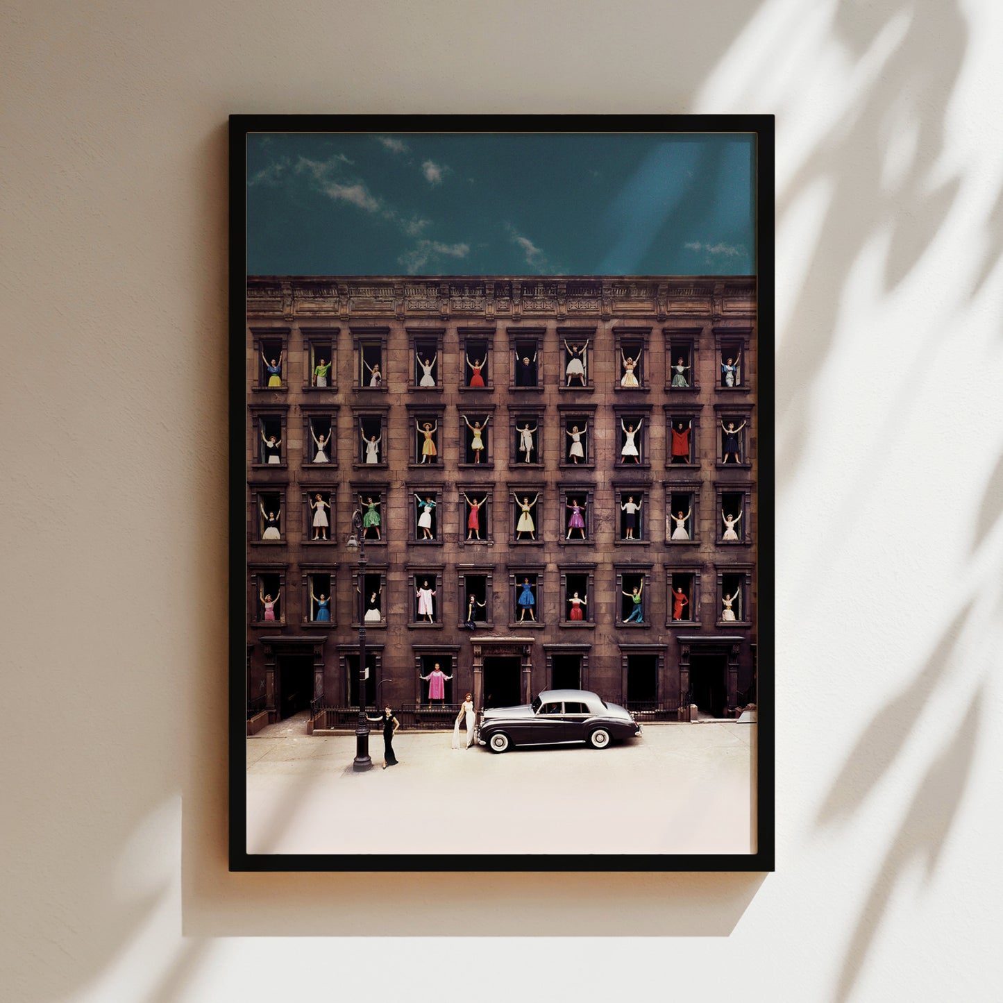 a picture of a building with a car parked in front of it