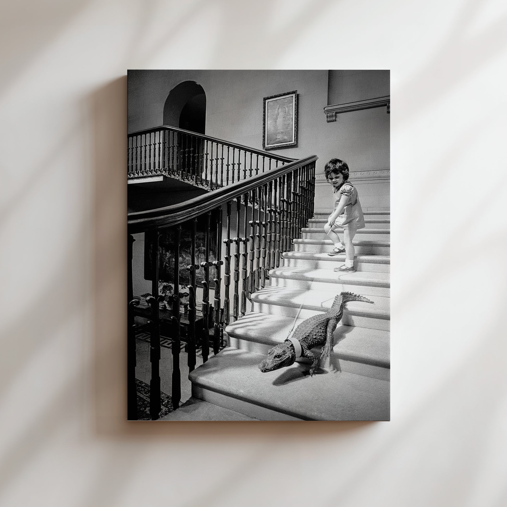 a black and white photo of a little girl walking down the stairs