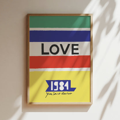 The image is a framed poster with the word "LOVE" prominently displayed in the center. Below the word "LOVE", there is a small text that reads "1984 Yes, you are not alone".