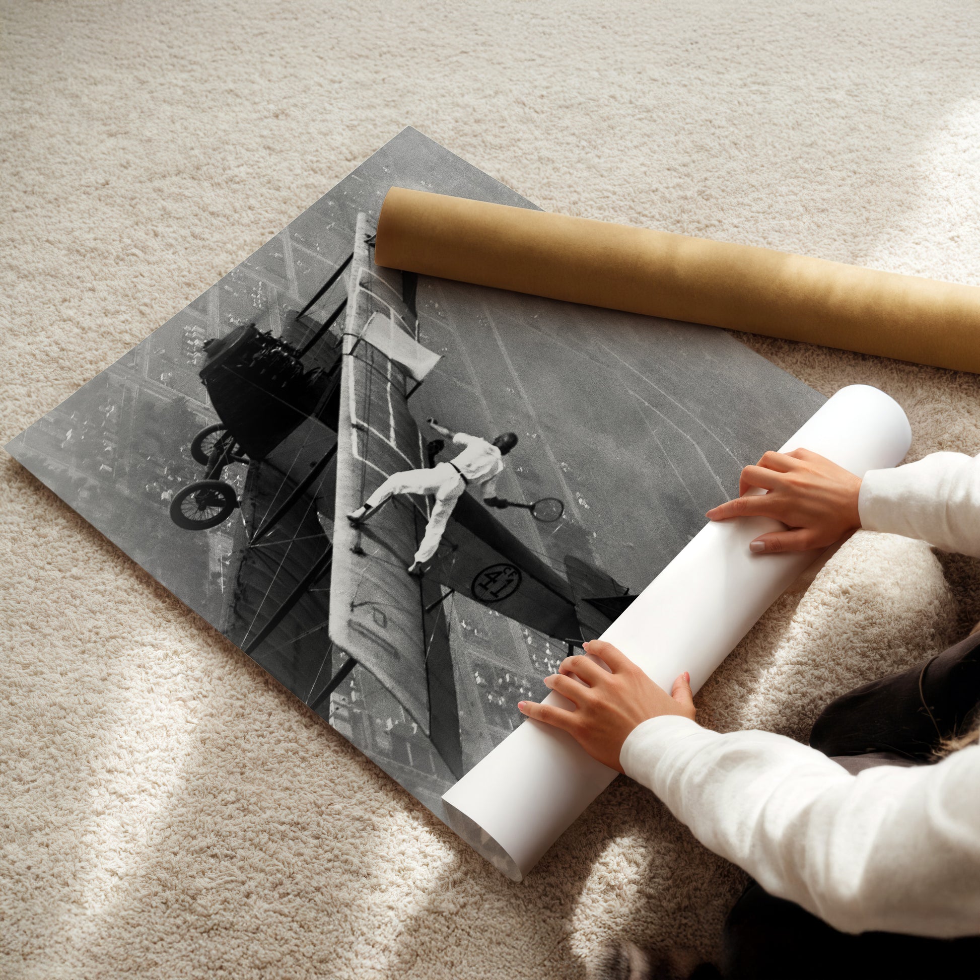 a young child is holding a rolled up paper