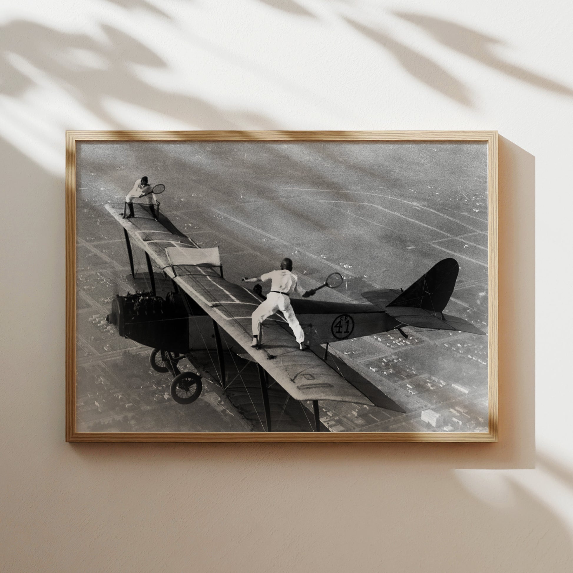 a black and white photo of a man on a plane