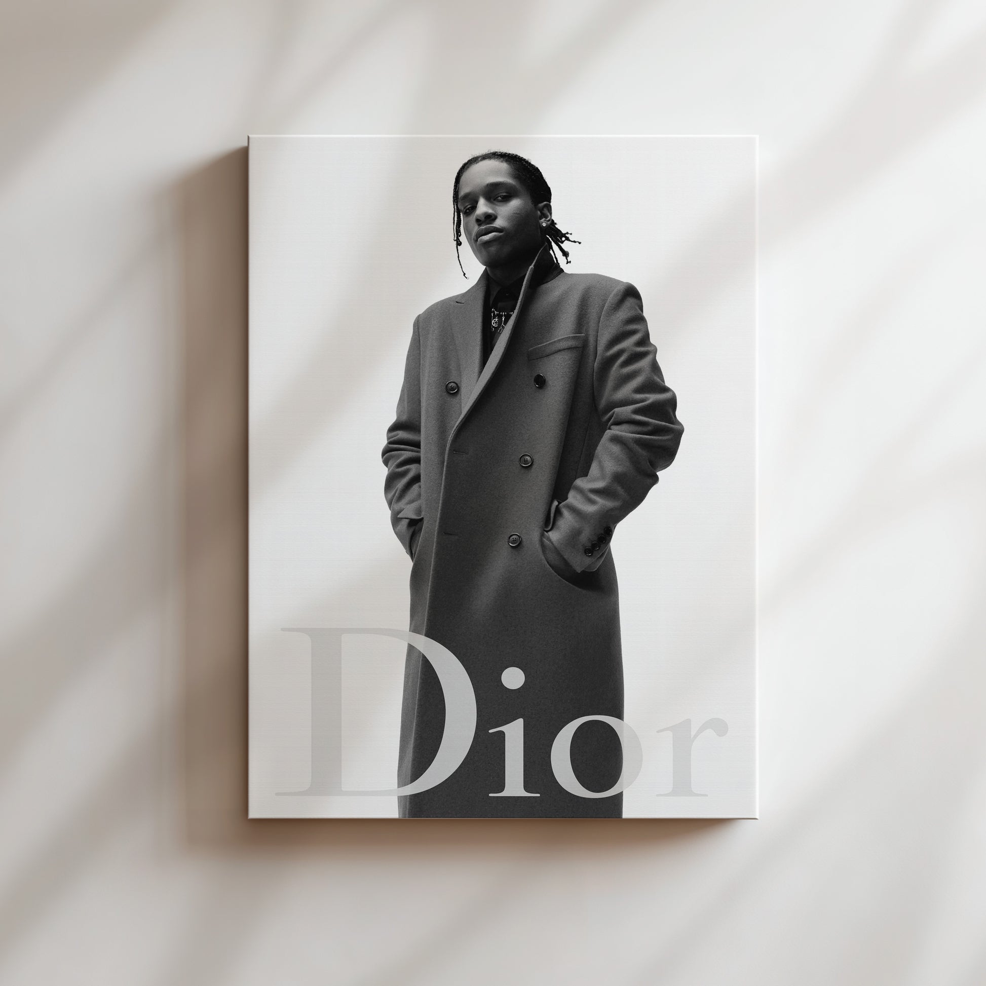 A black and white portrait of a person wearing a coat, with the word "Dior" prominently displayed below the image.