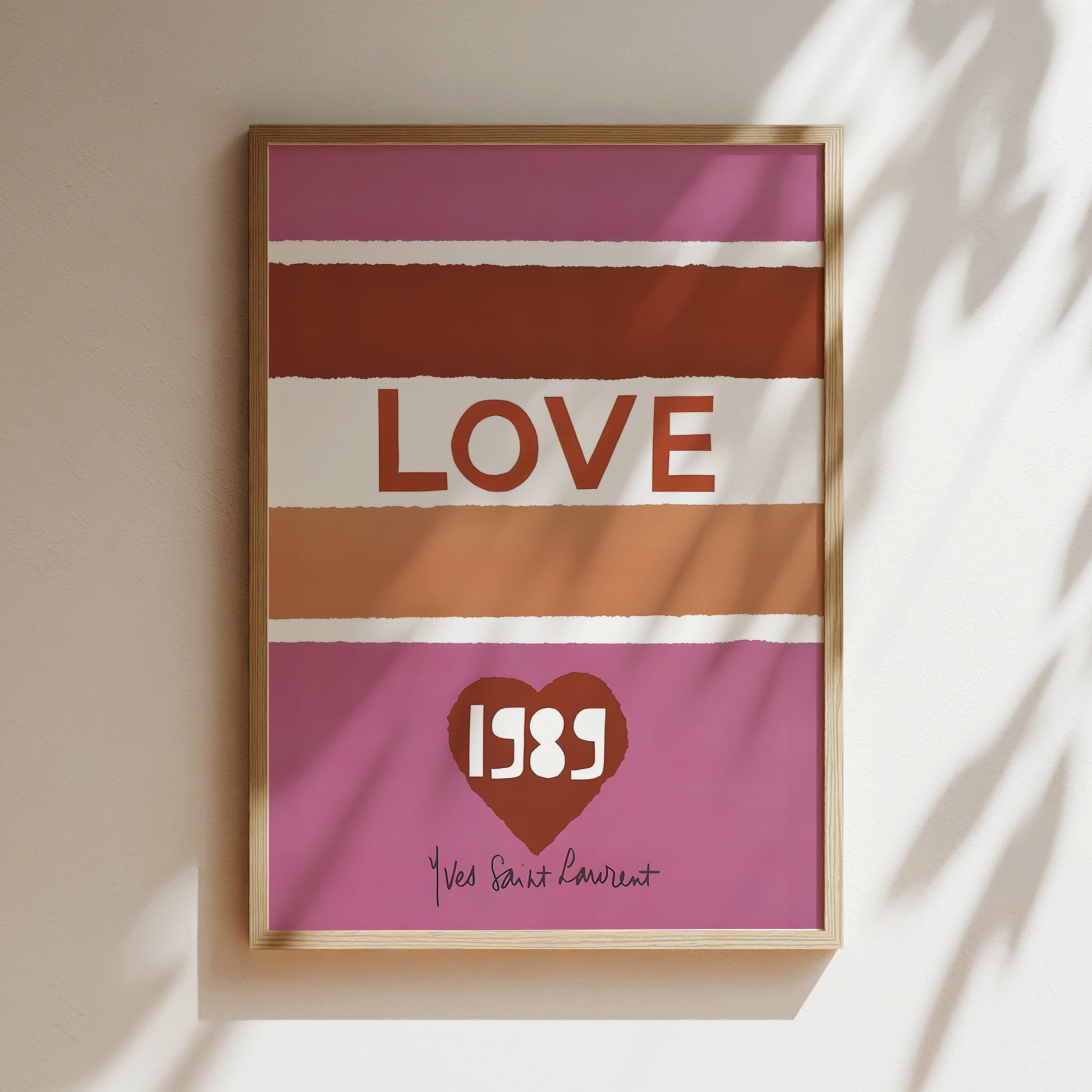 A framed poster with the word "LOVE" in bold letters, along with a heart symbol and the year 1989.