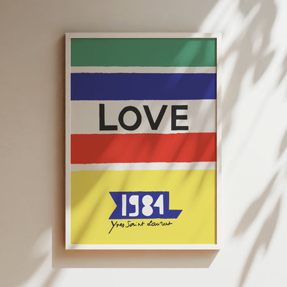 The image is a framed poster with a colorful design featuring the word "LOVE" in bold letters, along with the year "1984" and the phrase "Yes Saúde Nótido" below it.