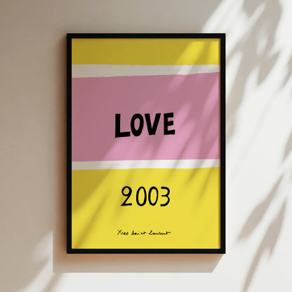 The image is a framed poster with a bold, colorful design featuring the word "LOVE" in large letters, with the year "2003" below it.