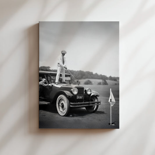 a black and white photo of a man standing on top of a car